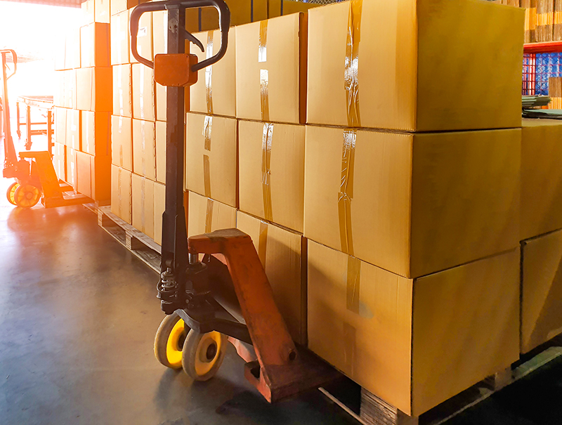 Shipping image featuring shipping pallets and a pallet jack