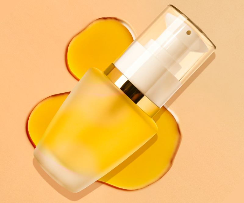 Turnkey Image features a skin care thames airless container with skin care formula against a yellow background